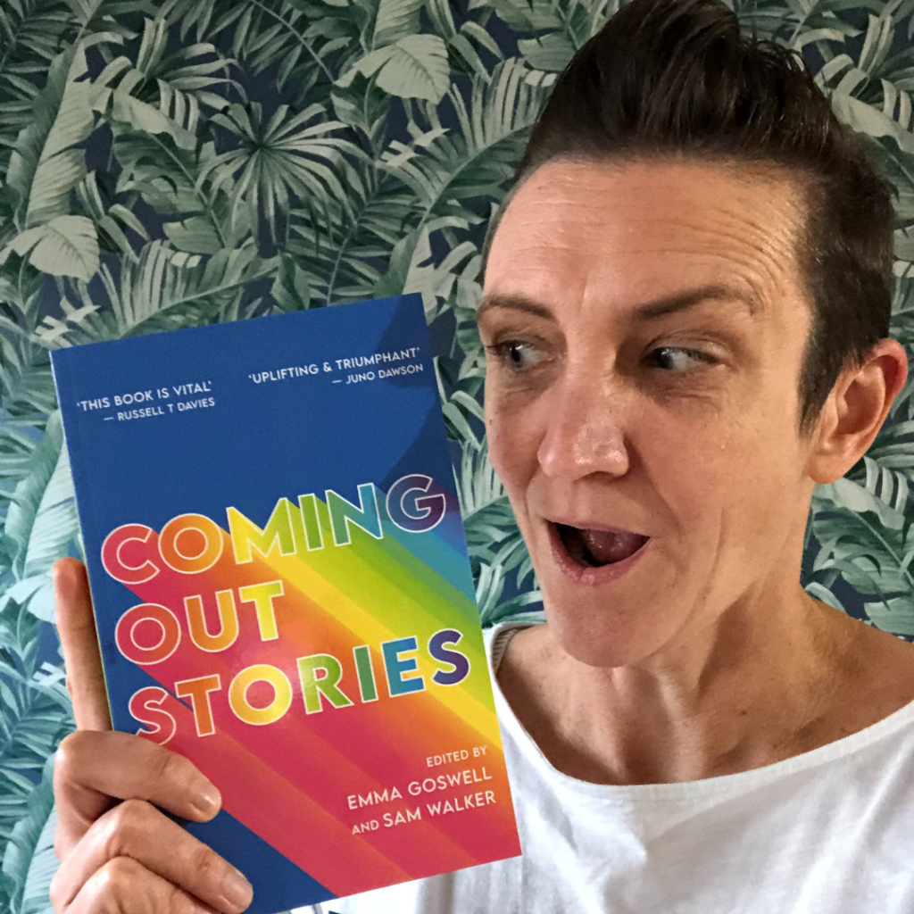 Emma Goswell holding Coming Out Stories book